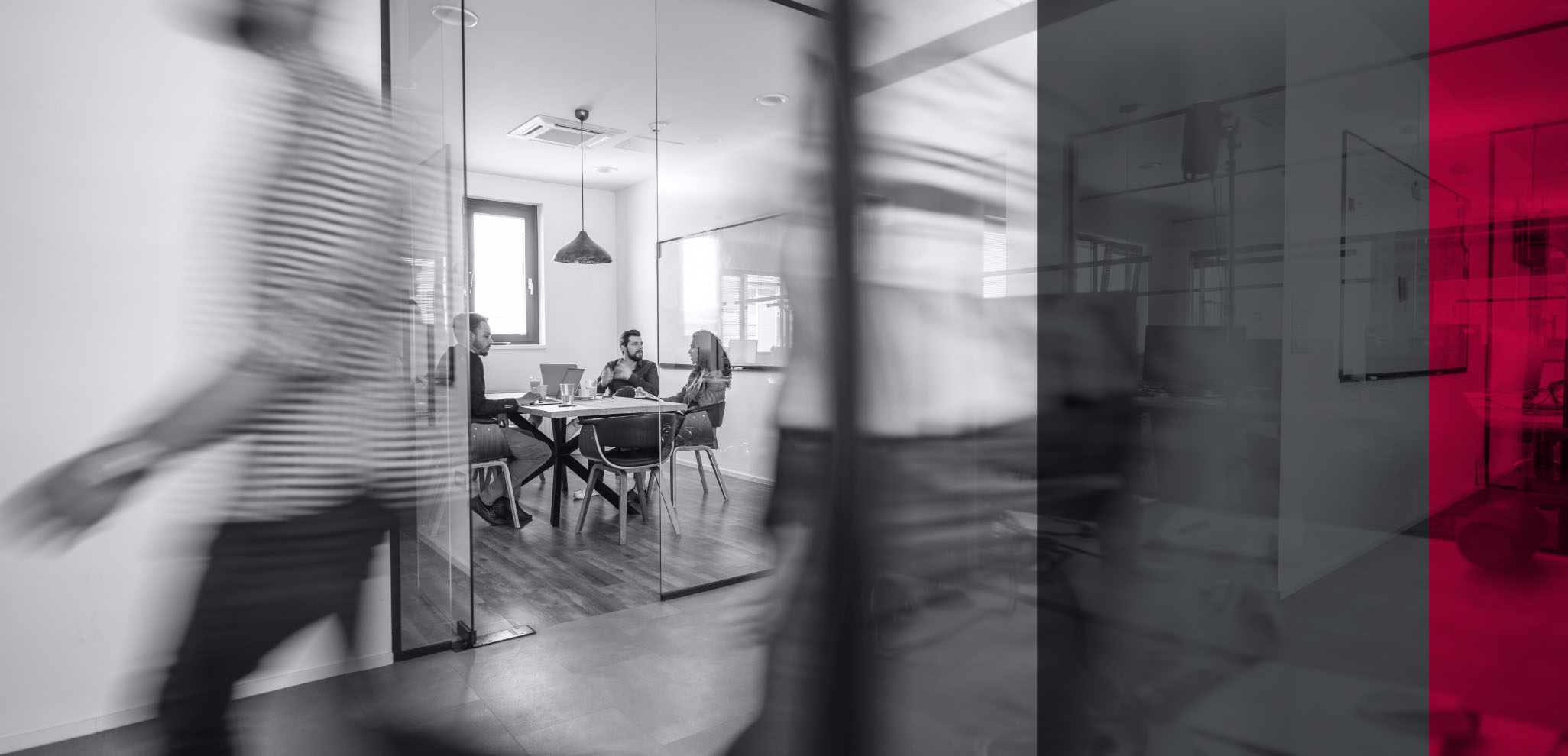 Employees having a meeting in room