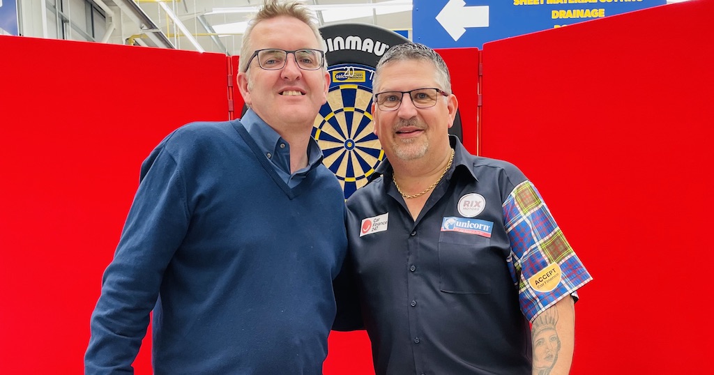 Picture shows James Garrison from 8848 with Gary Anderson, professional darts player at Selco Builders Warehouse in Cheltenham.