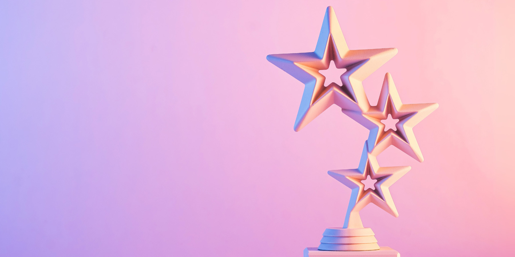 Pink stars on a gradient background