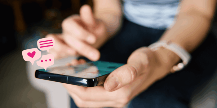Woman using phone with icons flashing up from phone